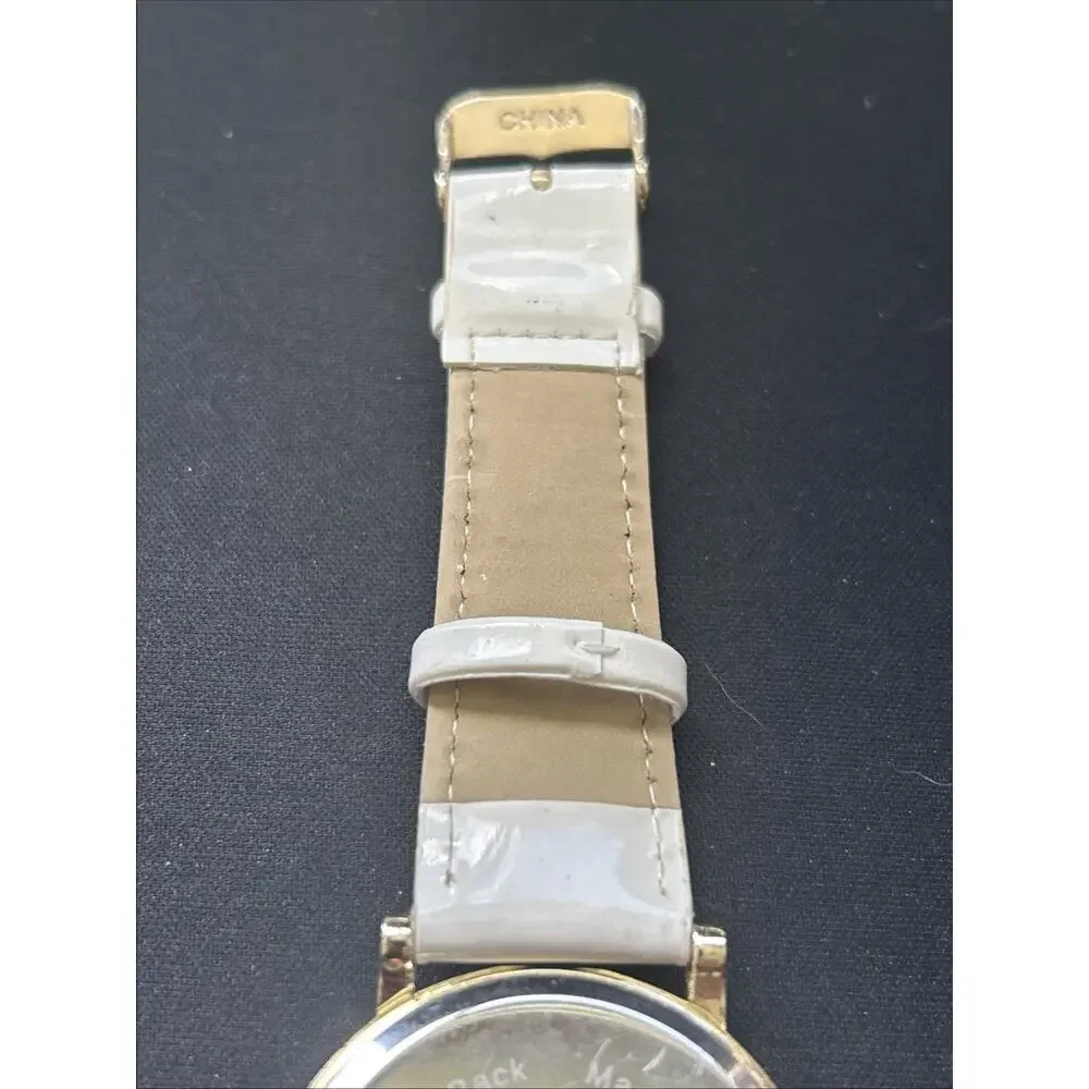 Gold Tone White Band Striped Dial Women’s Quartz Watch